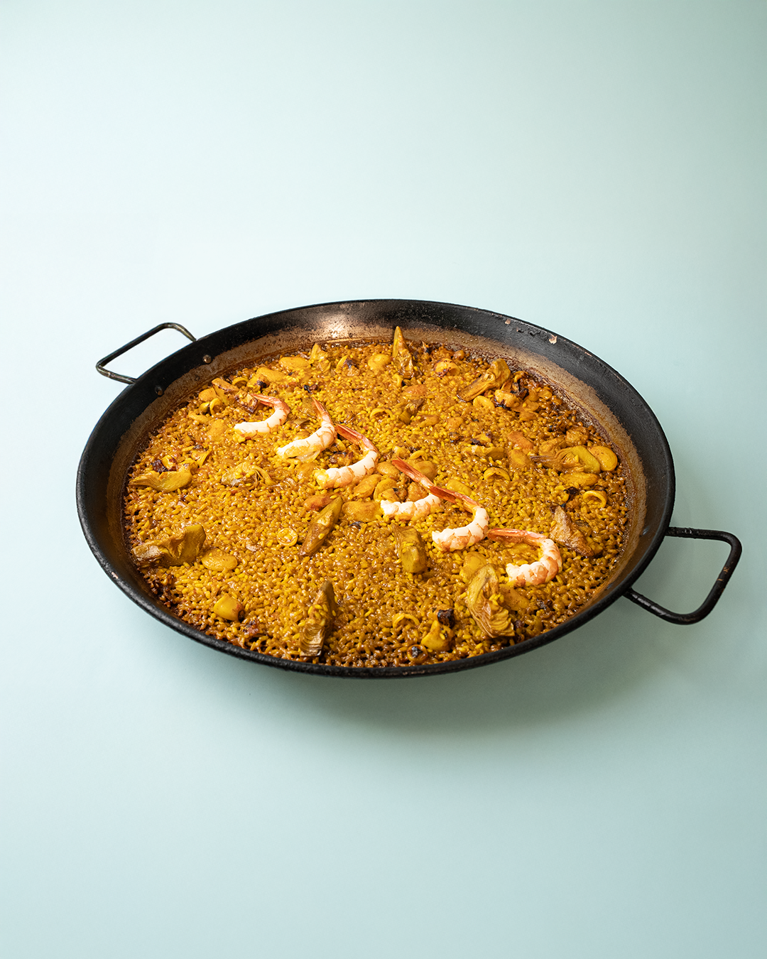 Arroz del senyoret con garrofó y alcachofa en Cullera frente al mar